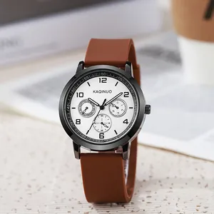 Detail of white quartz watch face with brown silicone strap and triple sub-dial design