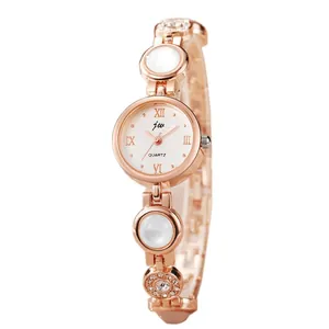 Elegant rose gold quartz watch with decorative bracelet strap and roman numerals