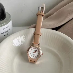 Elegant rose gold women's quartz watch with small white dial and tan leather strap