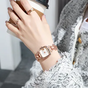 Elegant rose gold square watch for women with butterfly ring and chic urban styling