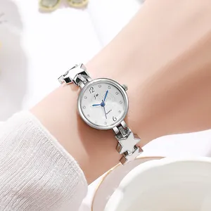 Elegant women's quartz watch featuring silver star-shaped bracelet and heart pattern dial