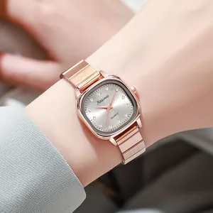 Elegant rose gold quartz watch for women with oval dial and rhinestone hour markers