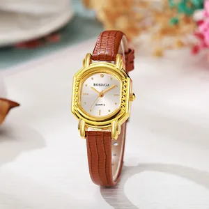 Montre à quartz tonneau dorée pour femme avec cadran blanc et bracelet en cuir marron