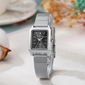 Close-up of elegant square silver mesh watch with black dial and minimalist markers