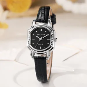 Detailed macro view of an elegant quartz watch with black leather strap and silver case
