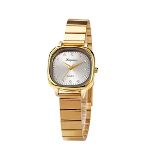 Elegant gold tone quartz watch for women with oval dial and bamboo-style steel bracelet
