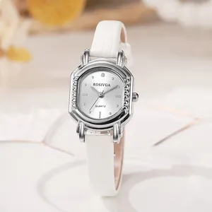 Detail of elegant silver tonneau watch face with white crocodile embossed leather strap