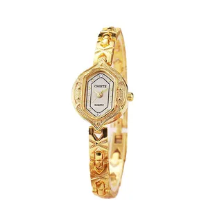 Elegant gold bracelet watch for women featuring a unique hexagonal dial and white face