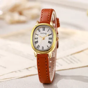 Montre à quartz vintage pour femme avec boîtier doré ovale et bracelet en cuir brun