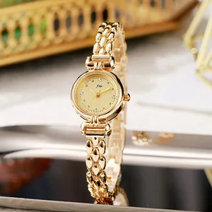 Elegante goldene Armbanduhr für Damen mit champagnerfarbenem Zifferblatt und Kristallen