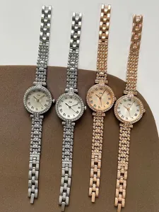 Detailed view of silver and rose gold quartz watches with crystal-set bezels and chain bands