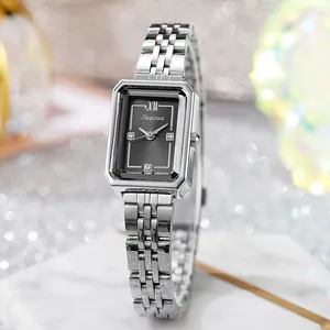 Macro view of rectangular black dial with rhinestone markers and five-link steel strap