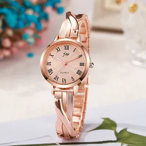 Montre quartz femme or rose avec bracelet métallique torsadé et chiffres romains