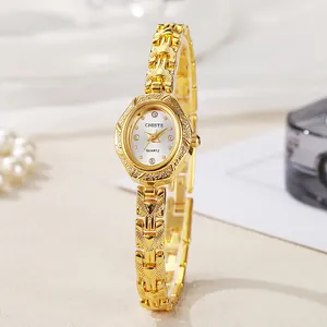Elegant gold oval bracelet watch for women with sparkling crystal markers and metal links