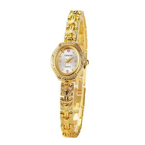 Elegant gold oval bracelet watch for women featuring a vintage textured metal link strap