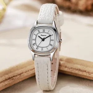 Vintage oval quartz watch for women with white leather strap and Roman numerals
