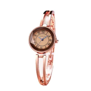 Women's rose gold chain watch with coffee dial, Roman numerals and brand logo