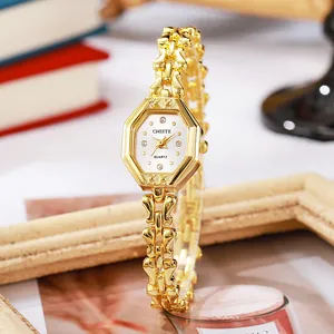 Elegante goldene Quarzuhr mit sechseckigem Zifferblatt und Retro-Metallarmband-Stil