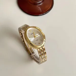 Orologio al quarzo dorato a forma di uovo con quadrante sunray e cinturino in metallo