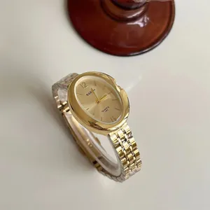 Elegante orologio al quarzo ovale dorato da donna con cinturino in metallo e quadrante sobrio