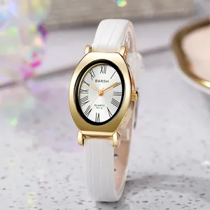 Detail view of oval gold case quartz watch with white Roman dial and crocodile leather strap