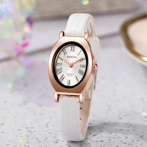 Detailed macro view of an oval rose gold watch case with white crocodile leather strap