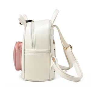 Sweet cream and pink bunny-eared backpack with golden metal adjusters and side pockets