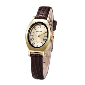 Vintage oval gold quartz watch with Roman numerals and brown crocodile leather strap