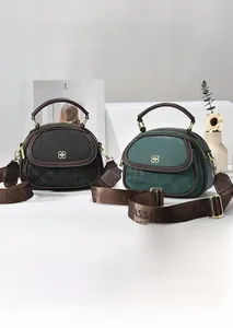 Detailed view of vintage multi-pocket handbags in black and green with textured finish