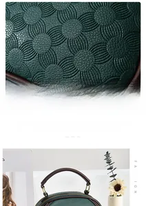 Close-up of dark green embossed sunflower pattern on pebbled leather handbag with brown handles