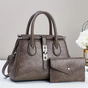 Vintage textured crossbody tote with matching envelope wallet and adjustable strap