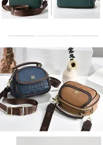 Close-up of luxury quilted leather handbags with wide branded straps and dual zippers