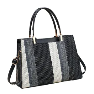 Large striped color-block tote bag with top handles and adjustable shoulder strap