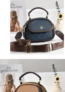 Detail view of stylish multi-pocket handbags with dual zippers and woven fashion straps