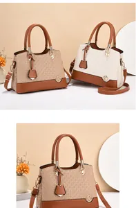 Detail of elegant woven texture handbags with metal logo and adjustable shoulder straps
