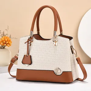 Multi-compartment beige woven handbag with brown faux leather trim and round handles