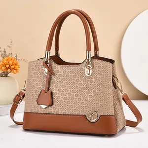 Beige woven handbag with brown leather trim and golden K logo for women's casual style