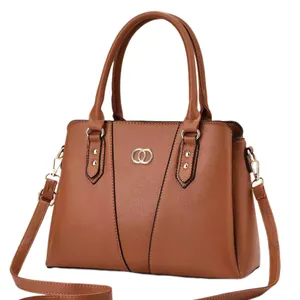 Classic brown pebble leather tote bag with gold logo and detachable shoulder strap