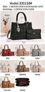 Detail view of two-piece quilted tote and envelope bag set with metallic leaf charm