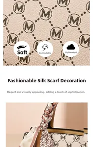Detail of soft monogram printed handbag featuring stylish scarf wrapped handle design