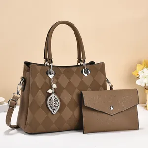 Brown quilted leather handbag set with diamond pattern and leaf charm for women