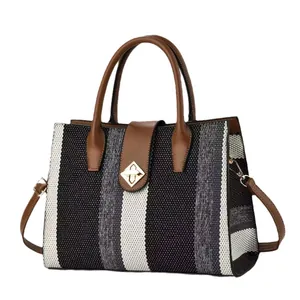 Minimalist large capacity striped handbag with brown leather straps and gold buckle