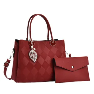Burgundy quilted tote and clutch set with leaf pendant in high-quality faux leather