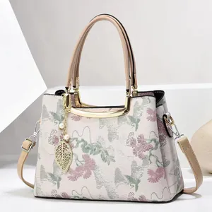 Elegant Chinese style floral embroidery tote bag with leather handles and gold leaf charm