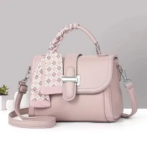 Pink lychee texture leather handbag with silk scarf handle and silver metal buckle