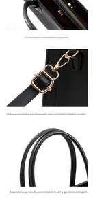 Detail view of gold metal zippers, electroplated hooks and reinforced handles of black tote