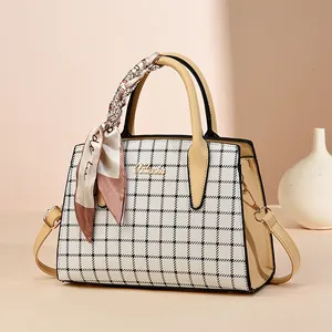 Chic checkered tote bag with beige leather trim and elegant silk scarf handle decoration