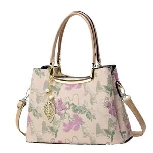 Elegant white Chinese style tote bag with floral embroidery and gold metal accents