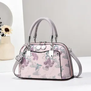 Sac à main avec motif floral et grue, finitions argentées en couleur violet doux