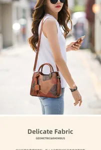 Macro shot of geometric patchwork leather handbag with vintage fringe detail for women
